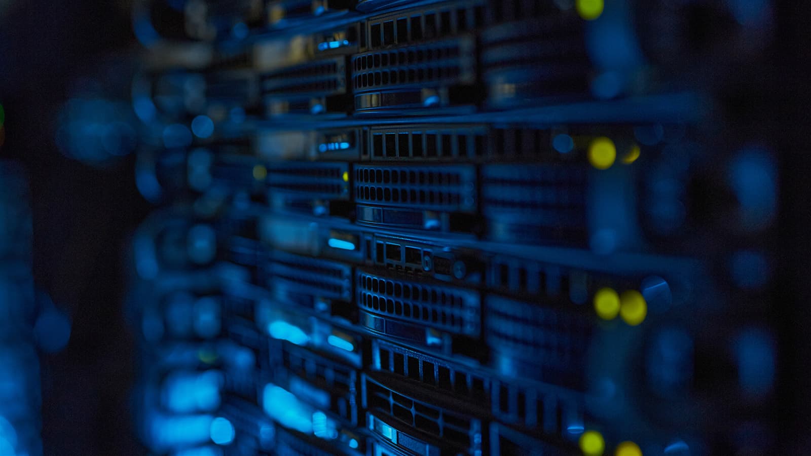 Closeup of a rack-mounted server with a glowing blue ambient light